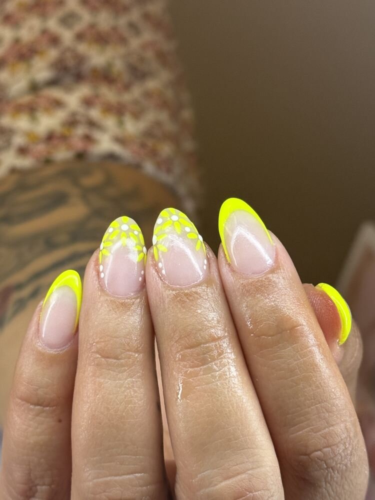 Neon yellow French tip almond nails with dot art